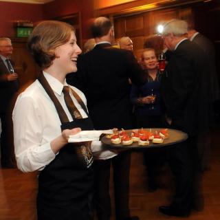 waitress serving canapes
